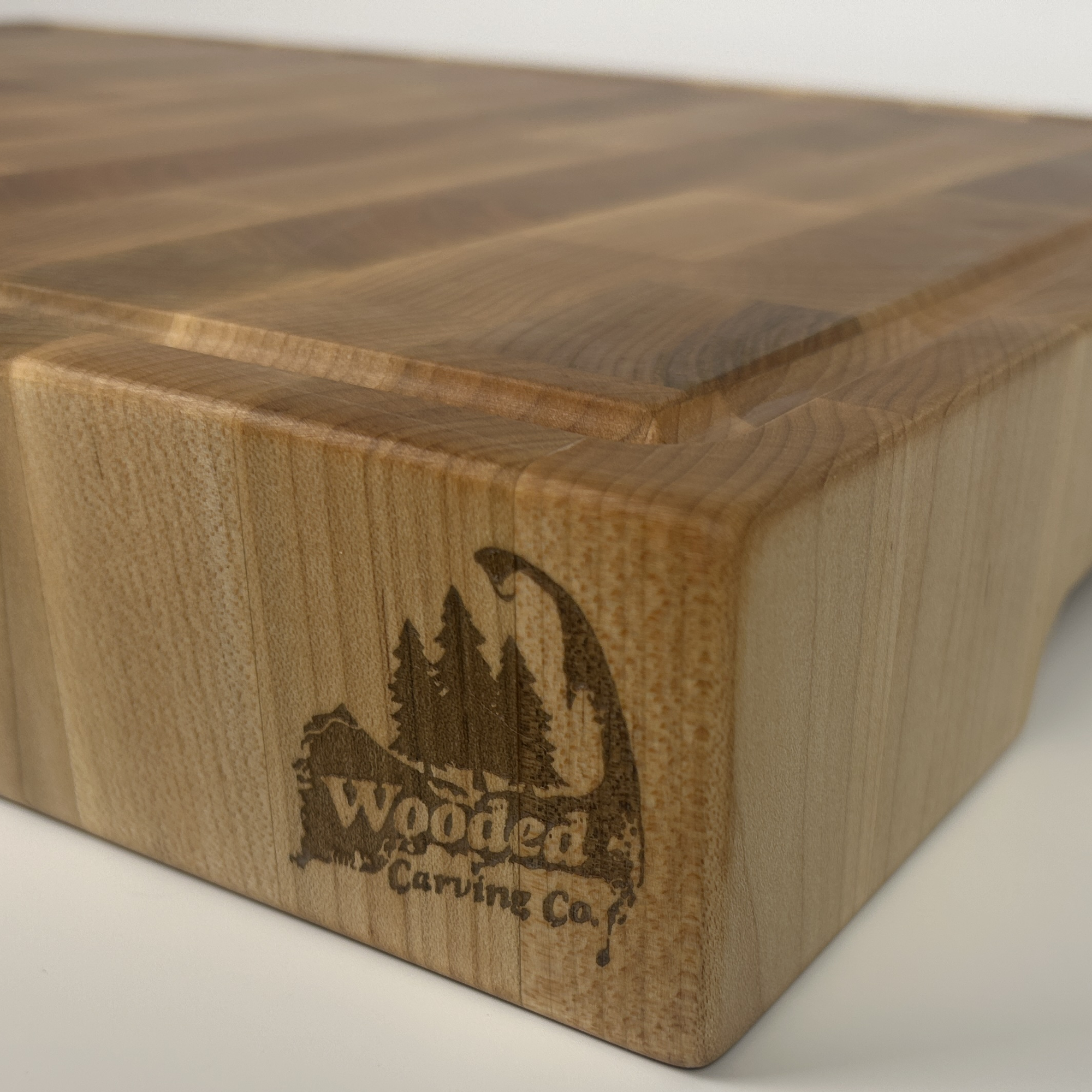 corner of a cutting board with a juice groove