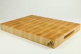 Wooden cutting board with a handle on a white background