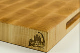 Wooden cutting board with a visible brand logo on a white background