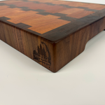 Wooden cutting board with a geometric pattern on a white background