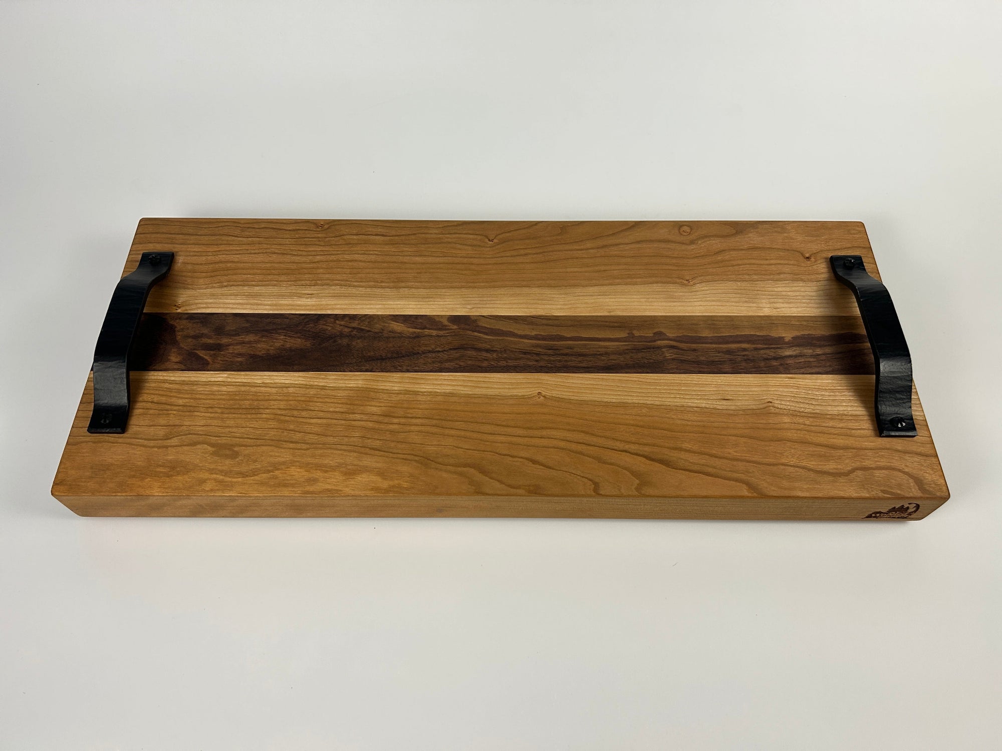Wooden tray with black handles on a white background