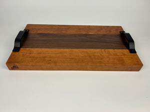 Wooden tray with black handles on a white background