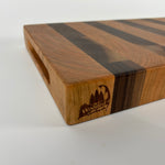 Wooden cutting board with a visible brand logo on a white background