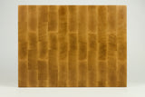 Wooden cutting board with a checkered pattern on a white background
