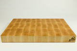 Wooden cutting board with grid pattern on a white background
