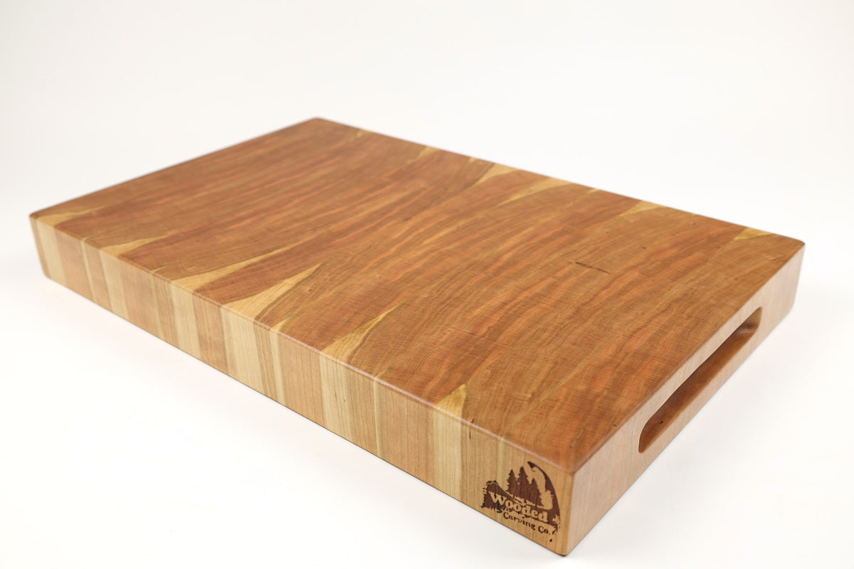 Mid-angle hero shot of Cherry Single No. 11 — Cherry end-grain cutting board, 11.5″ × 18.5″ × 2″