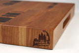 Corner detail of Five Cylinders showing the Wooded logo