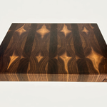 Thick End grain walnut cutting board with geometric heartwood and sapwood patterning top down view on a white background