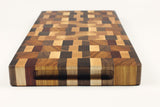 Handle-end view of Chaos Quilt , Maple, Walnut, Cherry, Padauk, and Canarywood end-grain cutting board
