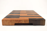 Handle-end view of Keys, Walnut and Cherry end-grain cutting board