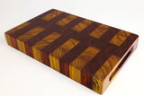 Mid-angle hero shot of Red Canary — Canarywood and Padauk end-grain cutting board, 14″ × 8.75″ × 2″