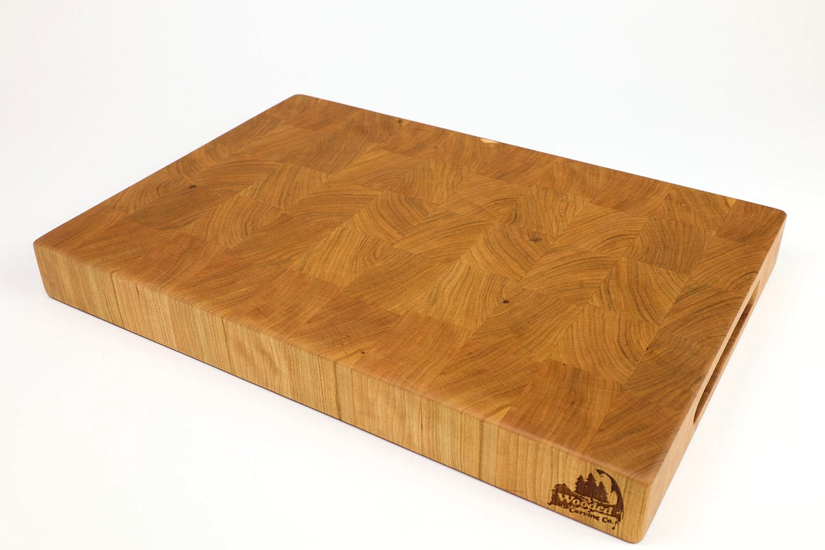 Mid-angle hero shot of Cherry Squares — Cherry end-grain cutting board, 12″ × 18″ × 2″