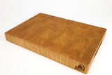 Mid-angle hero shot of Cherry Squares — Cherry end-grain cutting board, 12″ × 18″ × 2″