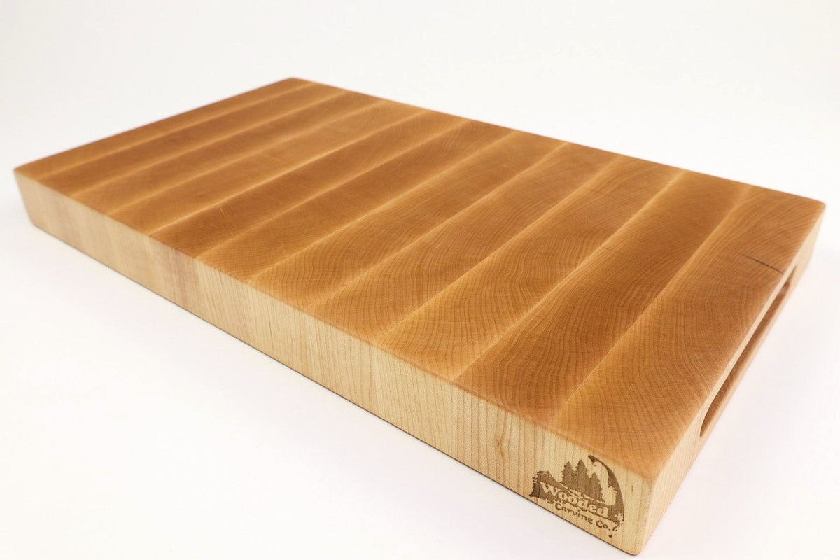 Mid-angle hero shot of Board Single - MapleMagic — Maple end-grain cutting board, 10.5″ × 18.75″ × 2″