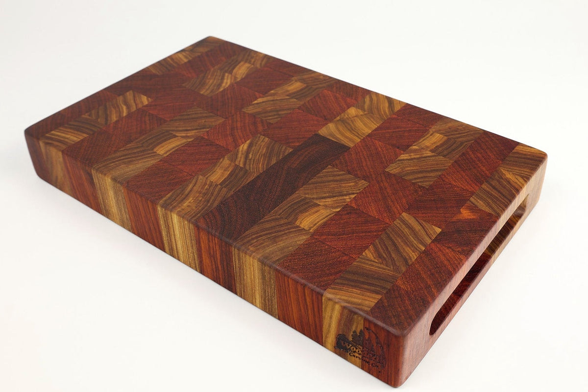 Mid-angle hero shot of Canary Sunset — Canarywood and Padauk end-grain cutting board, 14″ × 8.5″ × 2″
