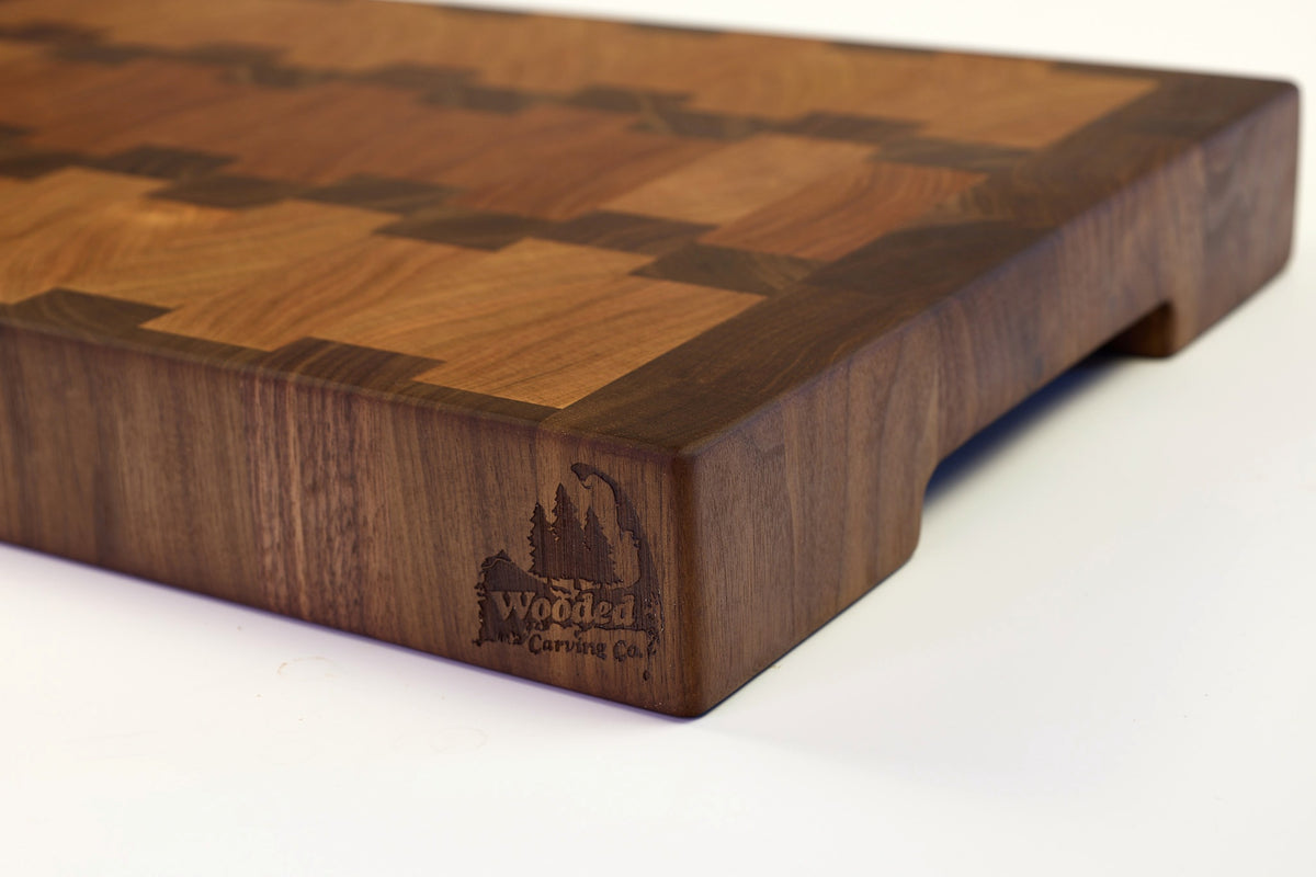 Mid-angle hero shot of A Rocky Road — Cherry and Walnut end-grain cutting board, 14″ × 20″ × 2.5″
