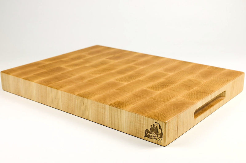 Wooden cutting board with a handle on a white background