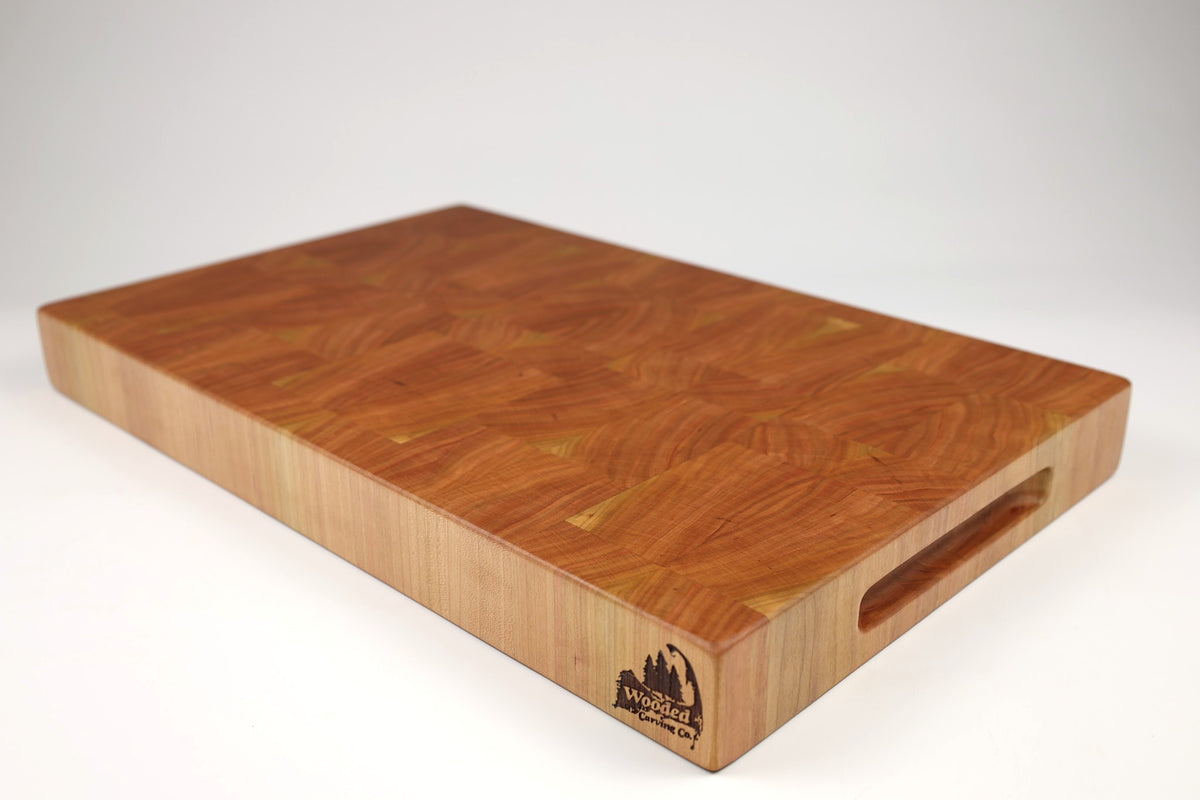 Mid-angle hero shot of Cherrantula — Cherry end-grain cutting board, 12.5″ × 20″ × 2″