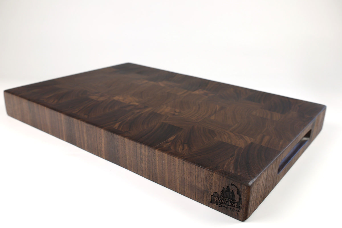 Mid-angle hero shot of Squares & Swirls — Walnut end-grain cutting board, 13.5″ × 19.5″ × 2″