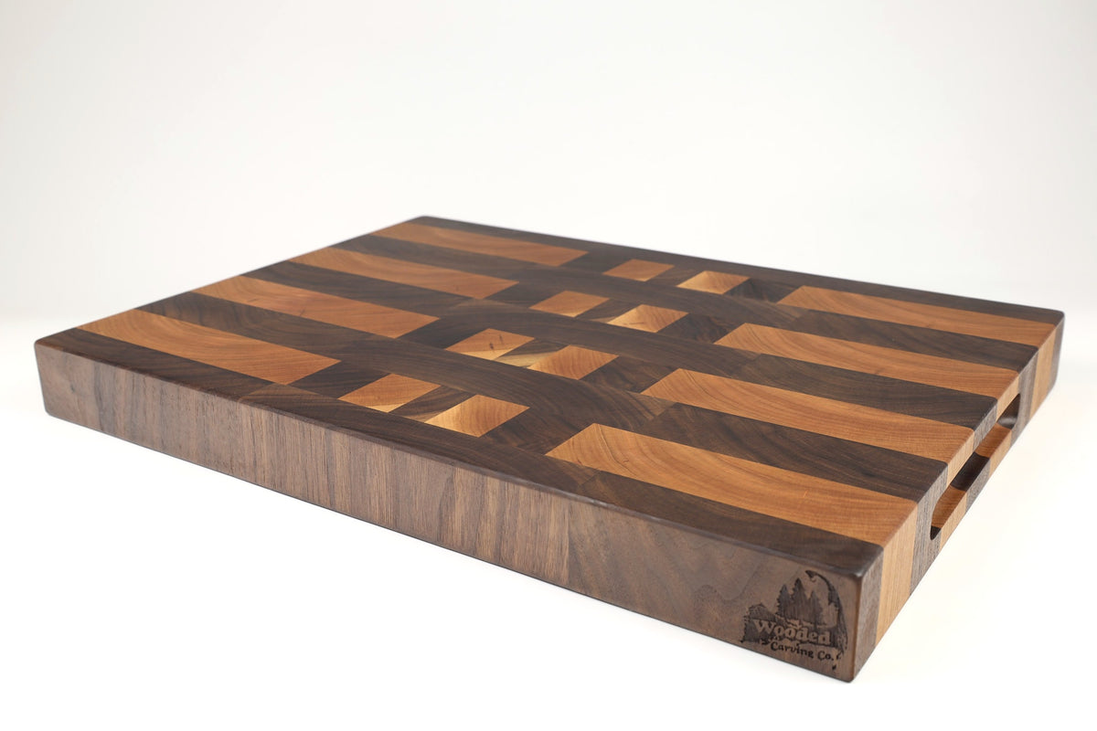 Mid-angle hero shot of Grain Pane — Walnut and Cherry end-grain cutting board, 14.5″ × 20″ × 2″