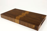 Mid-angle hero shot of Grainy Gorge — Walnut end-grain cutting board, 11″ × 18.75″ × 1.75″