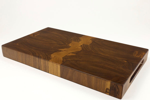Mid-angle hero shot of Grainy Gorge — Walnut end-grain cutting board, 11″ × 18.75″ × 1.75″