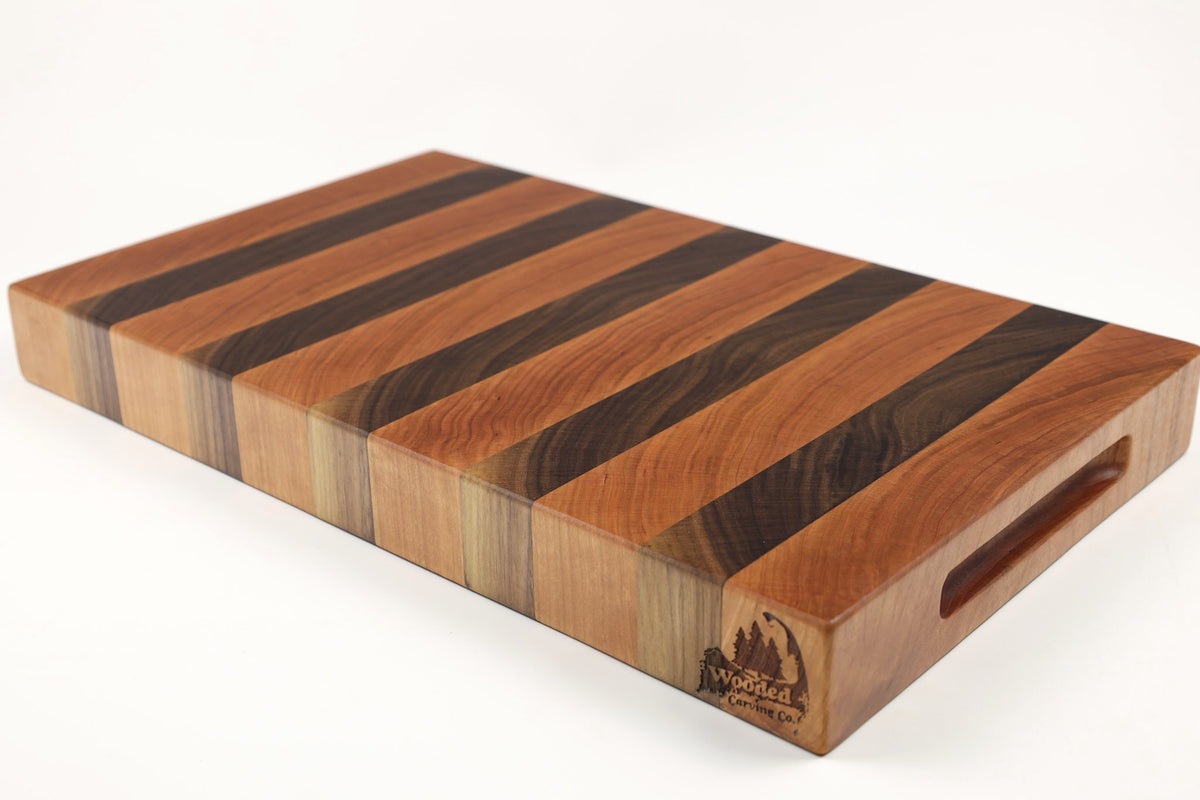 Mid-angle hero shot of Walnut & Cherry Single No. 2 — Cherry and Walnut end-grain cutting board, 11″ × 18.5″ × 2″
