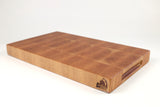 Mid-angle hero shot of Quilted Cherry — Cherry end-grain cutting board, 11″ × 18″ × 1.75″