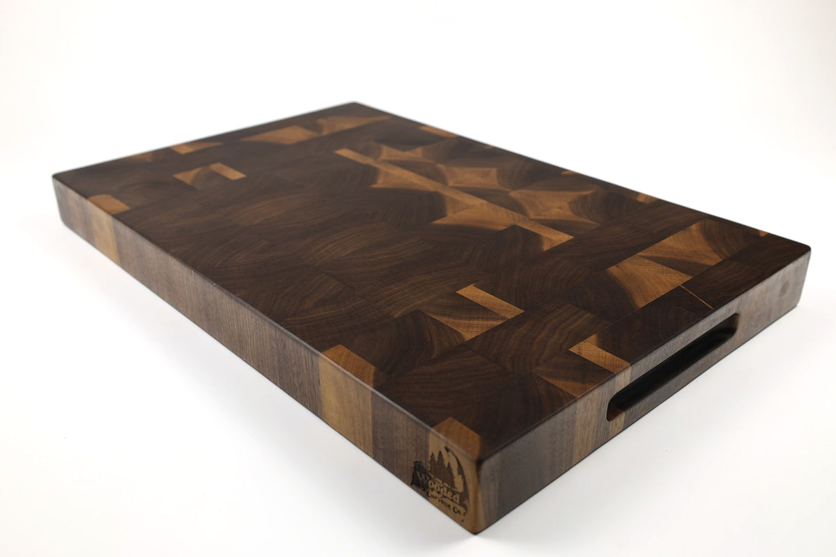 Mid-angle hero shot of Proscinium — Walnut end-grain cutting board, 14″ × 21.5″ × 2″