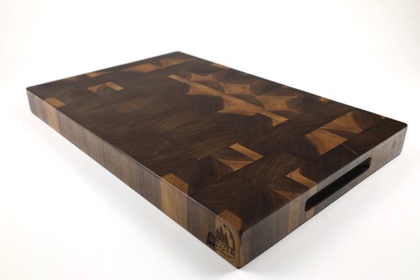 Mid-angle hero shot of Proscinium — Walnut end-grain cutting board, 14″ × 21.5″ × 2″