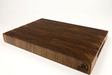 Mid-angle hero shot of Walnut Wave — Walnut end-grain cutting board, 12″ × 18″ × 1.75″