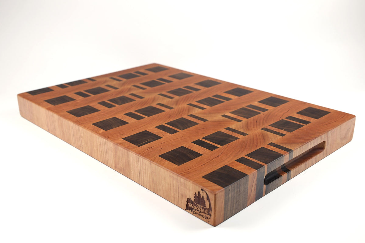 Mid-angle hero shot of Zippers — Cherry and Walnut end-grain cutting board, 15″ × 22″ × 2″