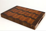 Mid-angle hero shot of Blocky Road — Walnut and Cherry end-grain cutting board, 17.5″ × 12″ × 2″