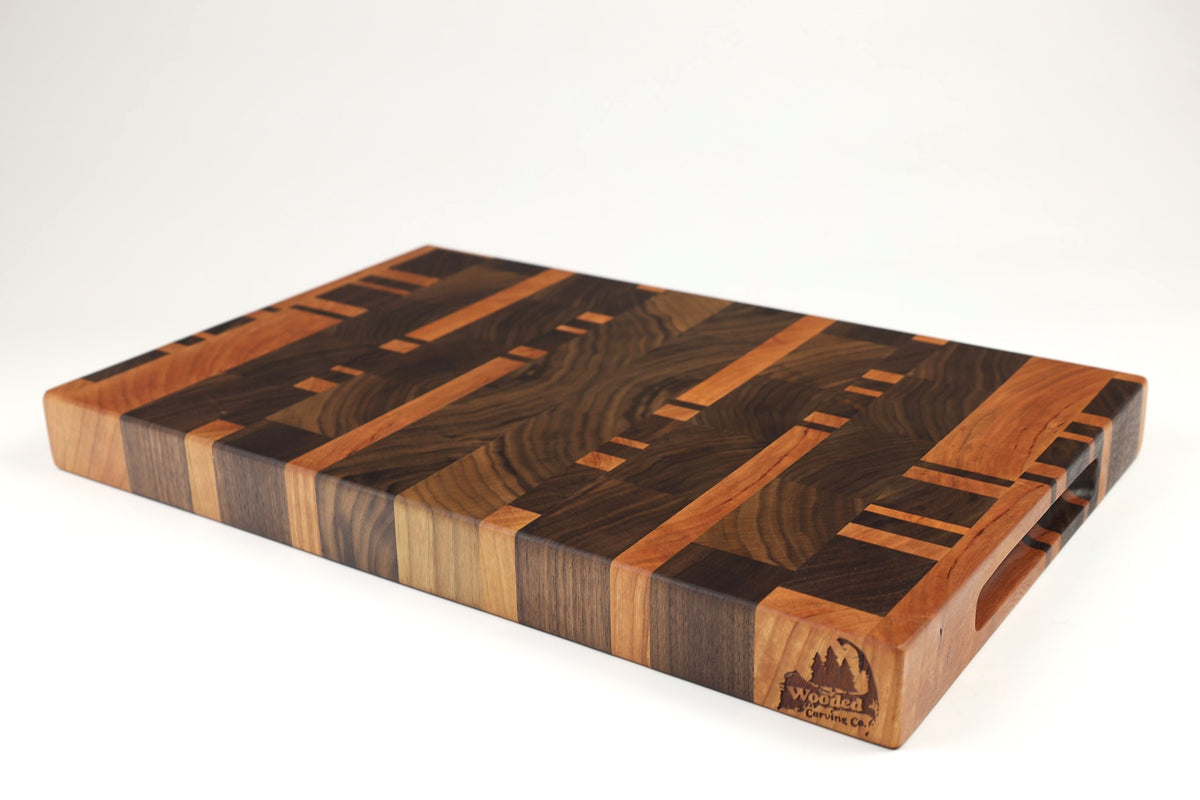 Mid-angle hero shot of 26051 — Walnut and Cherry end-grain cutting board, 12″ × 18.5″ × 1.75″