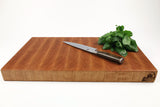 Side mid-angle of Cherry Single No. 10 with knife and fruit for scale