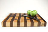 Side mid-angle of 26050 with knife and fruit for scale