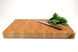 Side mid-angle of Cherry Single No. 9 with knife and fruit for scale