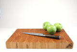 Side mid-angle of Hearty Cherry with knife and fruit for scale