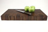 Side mid-angle of Key Walnut with knife and fruit for scale