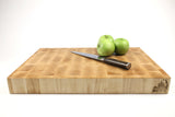 Side mid-angle of Wishbone with knife and fruit for scale