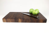 Side mid-angle of WorkingWalnutXL  with knife and fruit for scale