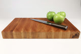 Side mid-angle of Cherry Slices with knife and fruit for scale