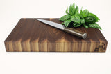 Side mid-angle of Walnut Single No. 9 with knife and fruit for scale