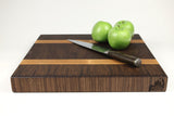 Side mid-angle of Grainy Lane with knife and fruit for scale