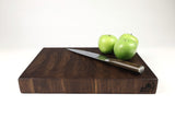 Side mid-angle of WalnutWorkhorse26 with knife and fruit for scale