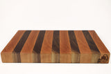 Side view of Walnut & Cherry Single No. 2 from ~45°, logo facing camera