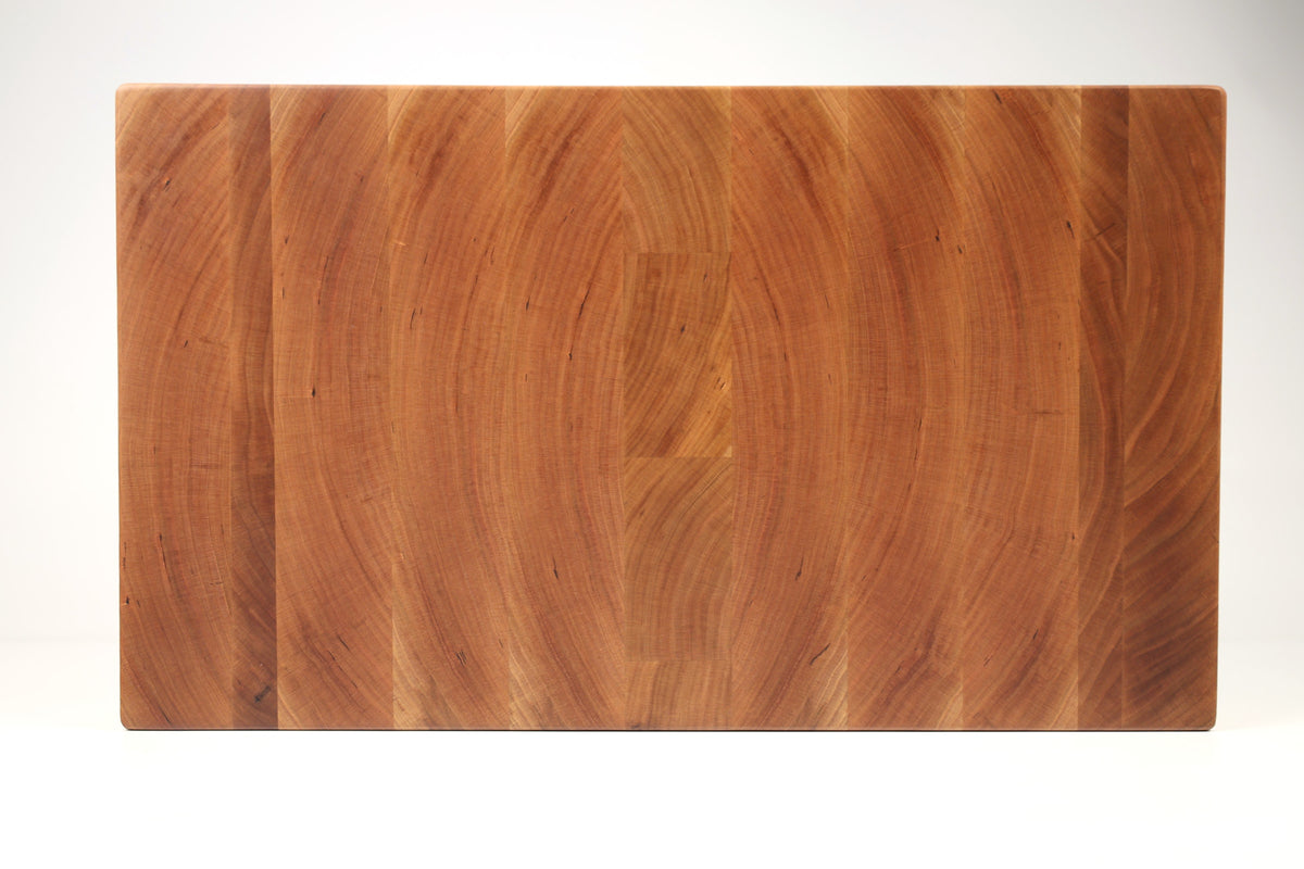 Top-down view of Cherry Slices — Cherry end-grain cutting board, 11″ × 19″ × 2″