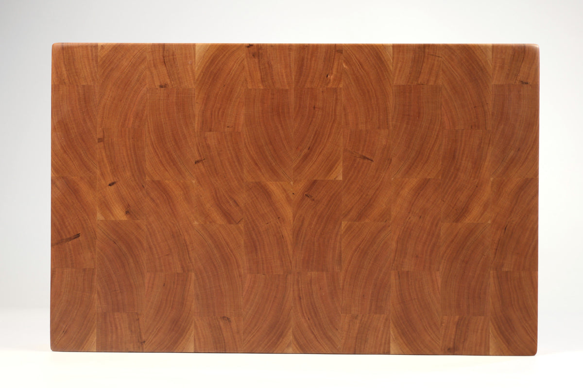 Top-down view of Hearty Cherry — Cherry end-grain cutting board, 12″ × 18″ × 2″