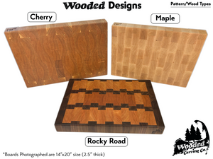 Wooden cutting boards with 'Cherry', 'Maple', and 'Rocky Road' patterns, branded as Wooded Carving Co.